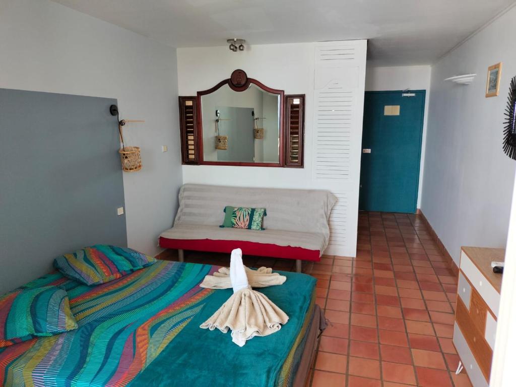 Postel nebo postele na pokoji v ubytování Appartements vue mer - Résidence de la baie - Tartane