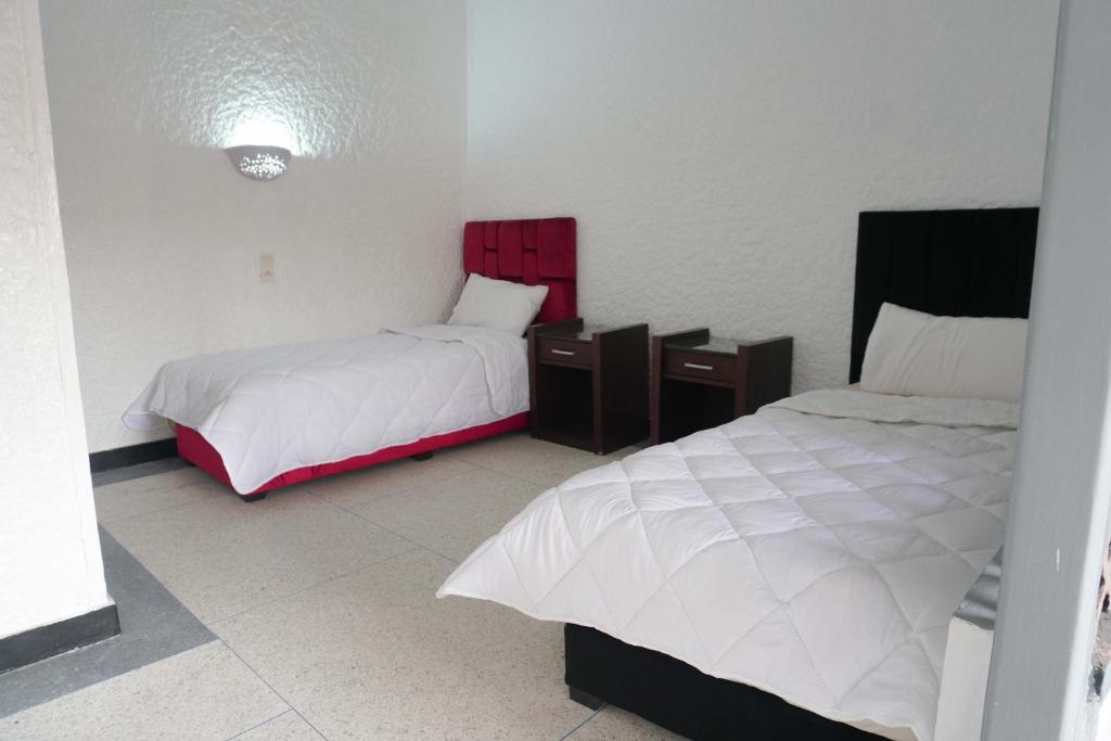 Postel nebo postele na pokoji v ubytování Hotel Warda