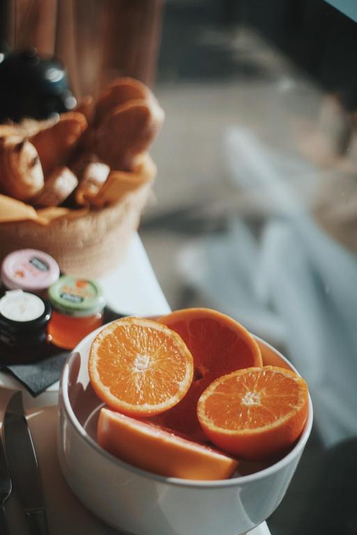 a bowl of orange slices sitting on a table at Palm Beach in Ajaccio