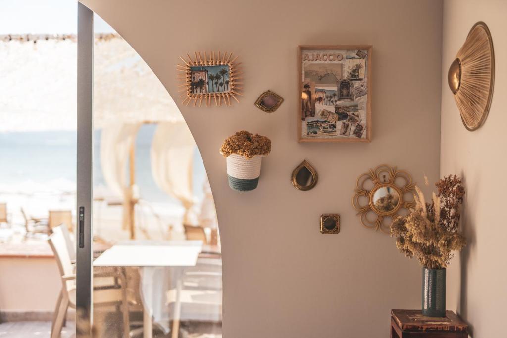 a dining room with a dining table and a dining roomiasm at Palm Beach in Ajaccio