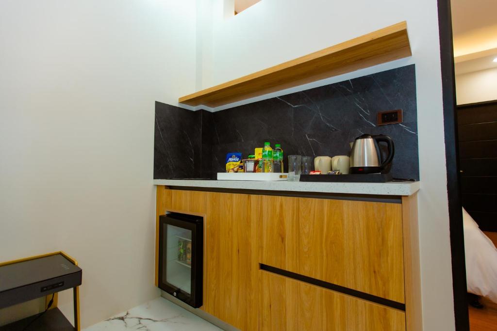 Kuchyň nebo kuchyňský kout v ubytování Rockfort Hotel