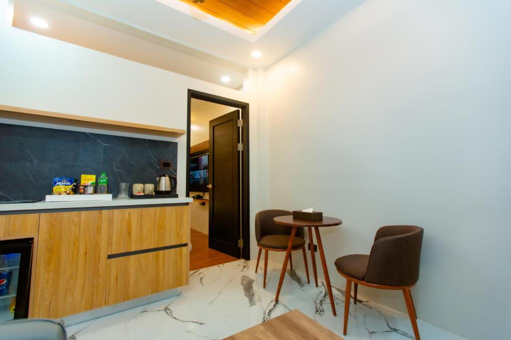 Kuchyň nebo kuchyňský kout v ubytování Rockfort Hotel