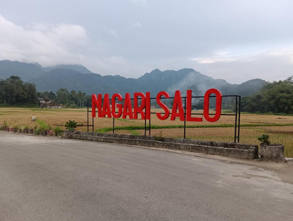 a sign for a mega sale on the side of a road at Balqis Homestay Syariah III Nagari Salo Kec Baso Kab Agam in Baso
