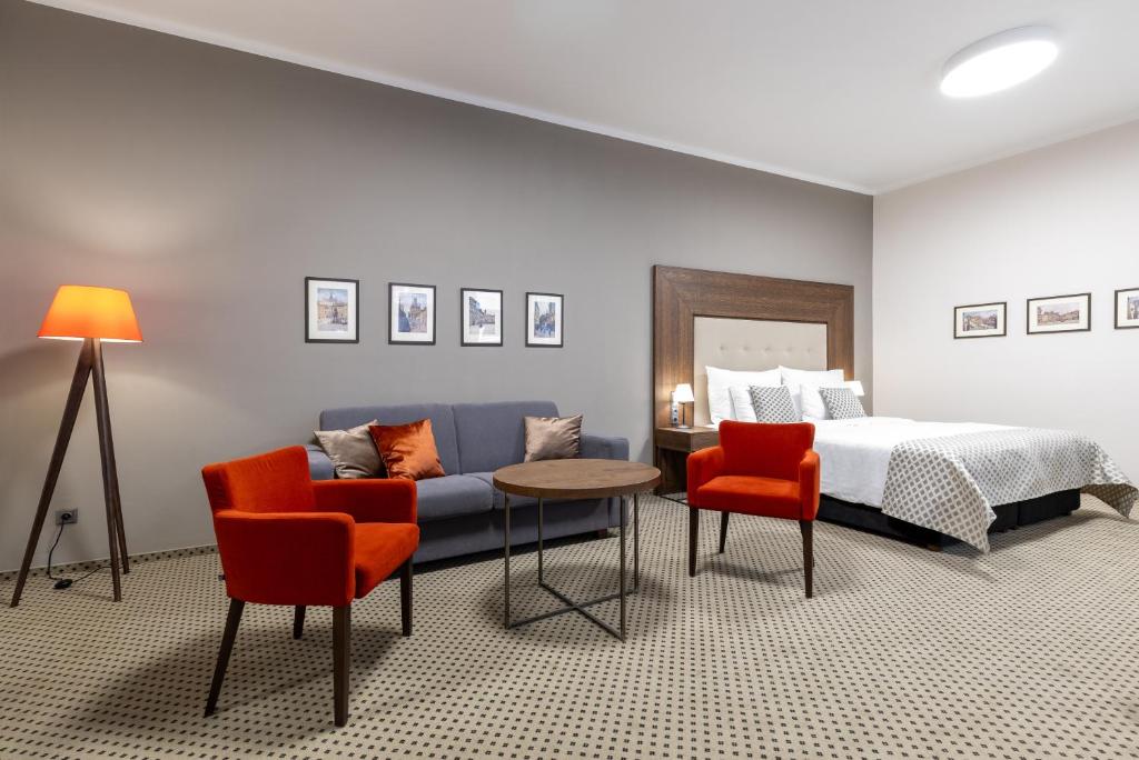 Postel nebo postele na pokoji v ubytování Hotel Ikona