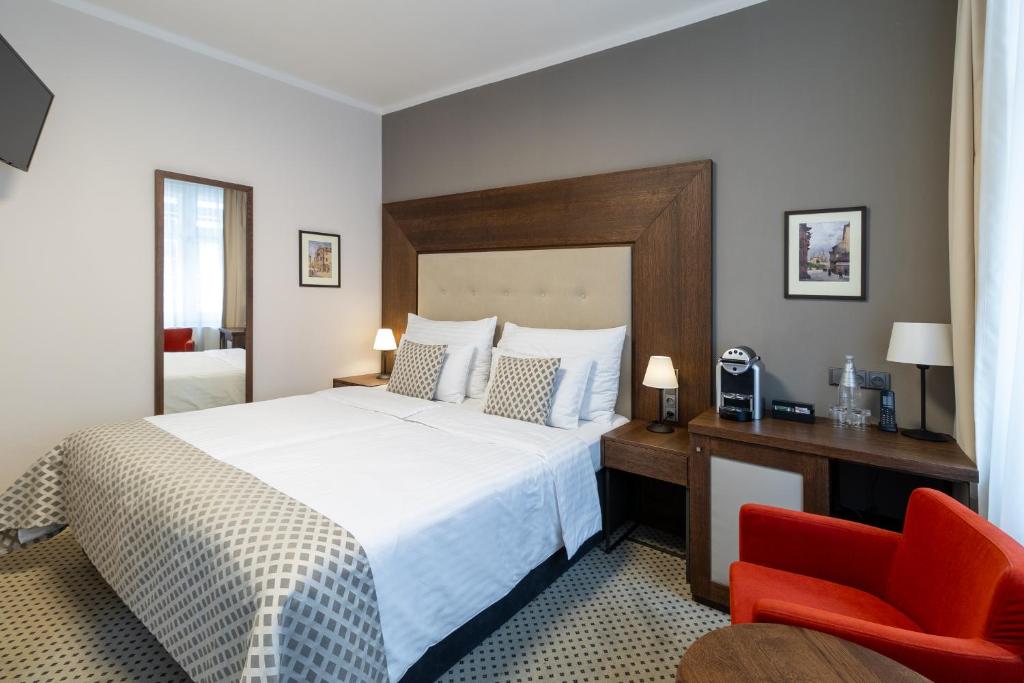 Postel nebo postele na pokoji v ubytování Hotel Ikona