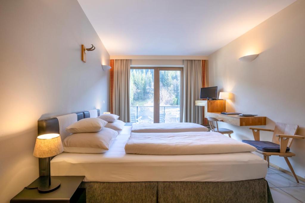 Postel nebo postele na pokoji v ubytování Hotel Edelweiss
