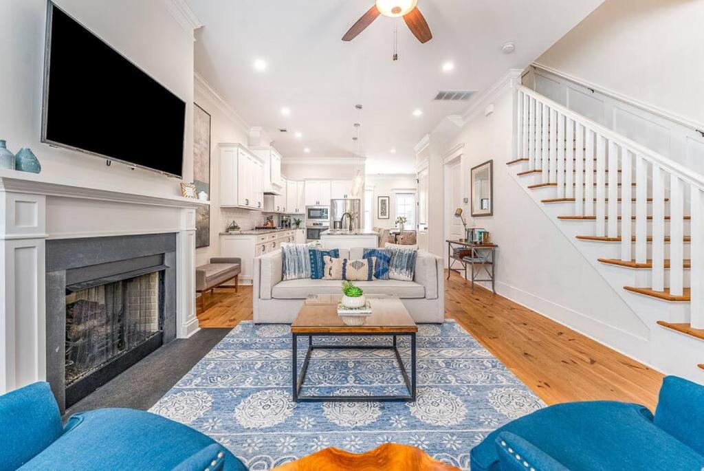 a living room with a fireplace and a tv at Magnolia House - 3BR, Downtown, Easy Parking in Savannah