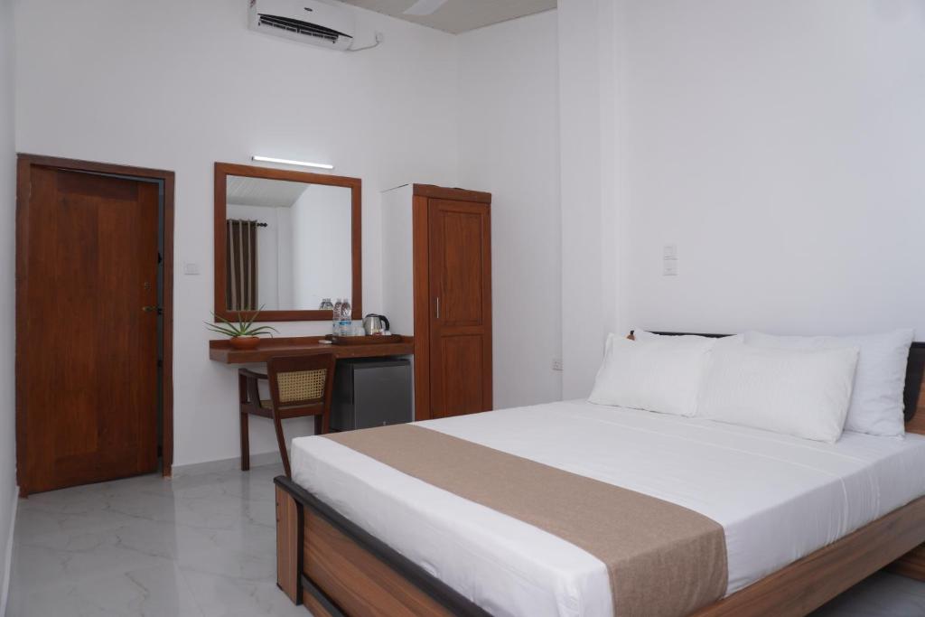 Postel nebo postele na pokoji v ubytování SURF UNA BEACH HOTEL