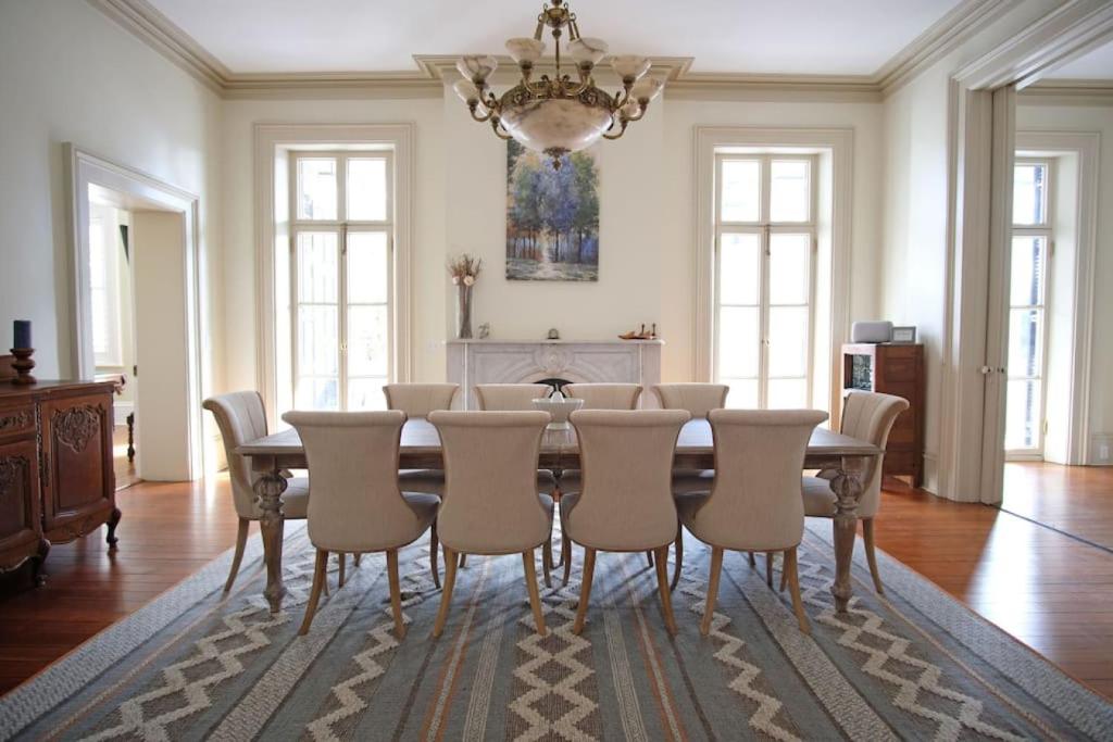 a dining room with a table and chairs at 8BR Historic Hamilton House in Savannah