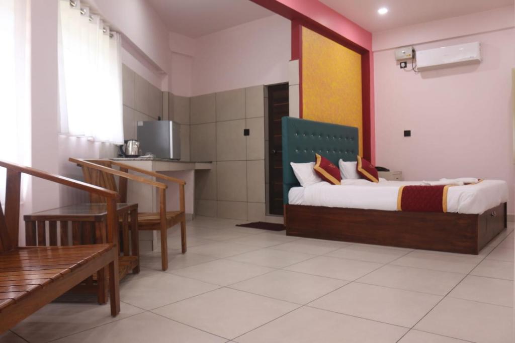 Postel nebo postele na pokoji v ubytování Hotel Wayanad Stay