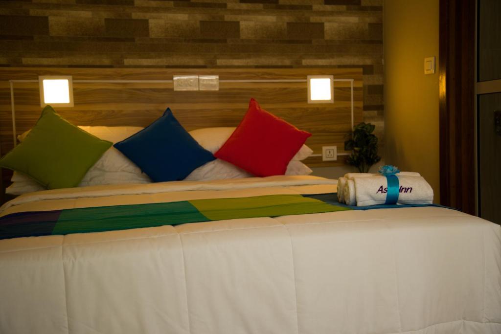 Postel nebo postele na pokoji v ubytování Asia Inn Maldives