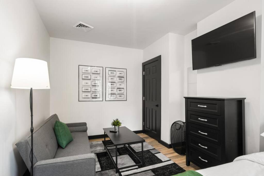 a living room with a couch and a flat screen tv at Charming 1BR,1BA Gem with Free Parking in Philly in Philadelphia
