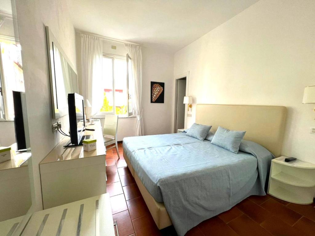 Postel nebo postele na pokoji v ubytování Hotel Clelia