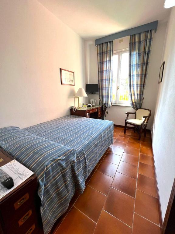 Postel nebo postele na pokoji v ubytování Hotel Clelia