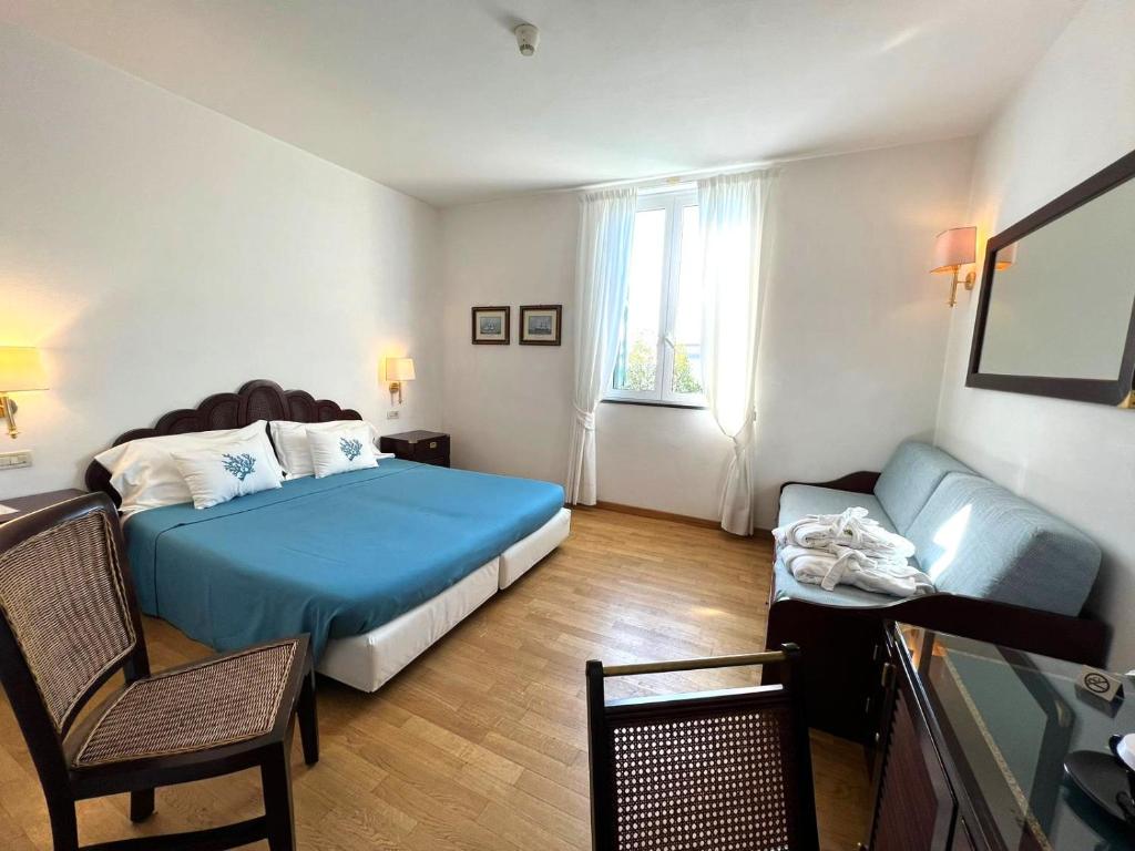 Postel nebo postele na pokoji v ubytování Hotel Clelia