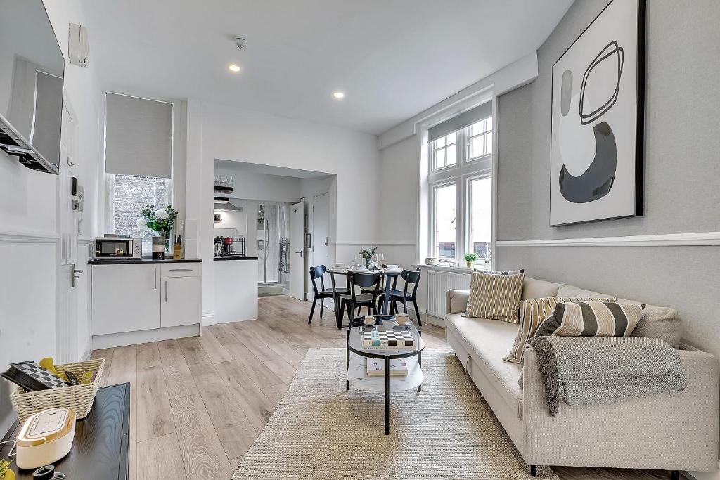 a living room with a couch and a table at The Pembroke in London