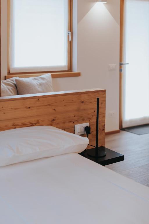 Postel nebo postele na pokoji v ubytování Falcade Lodge