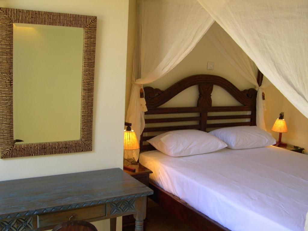 Postel nebo postele na pokoji v ubytování Rastoni Hotel Aegina