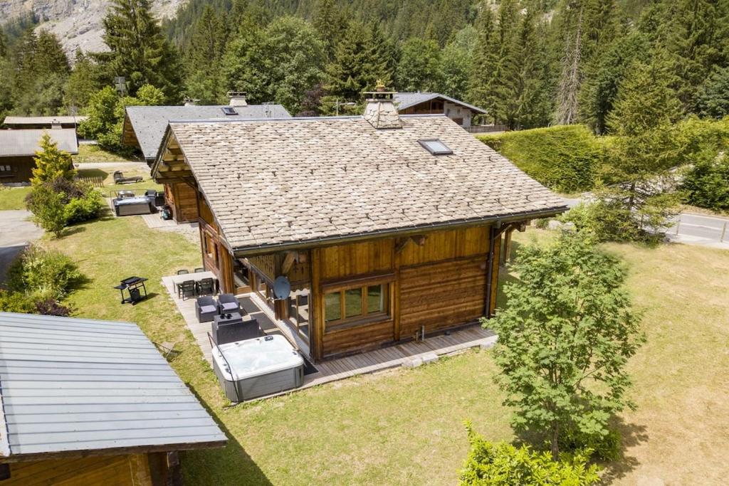 an overhead view of a log house with a yard at Chalet Haut Fort Ski Injacuzzi in Morzine