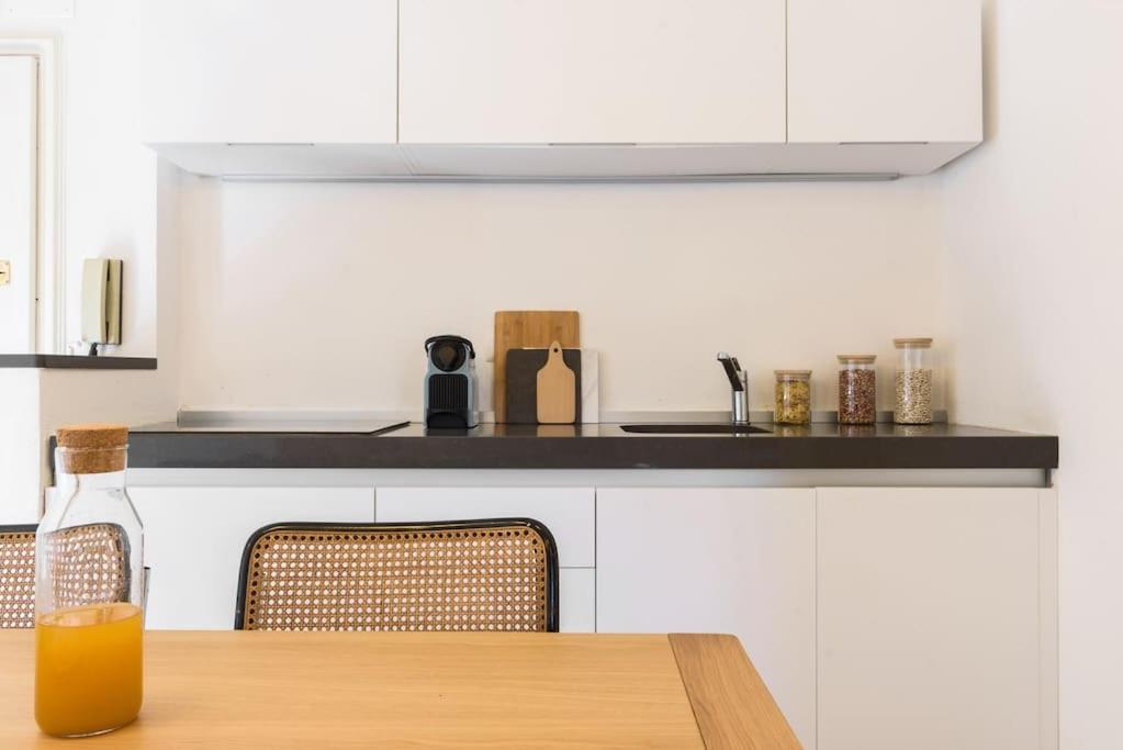 A kitchen or kitchenette at Portofino Dream Flexyrent NO air conditioning