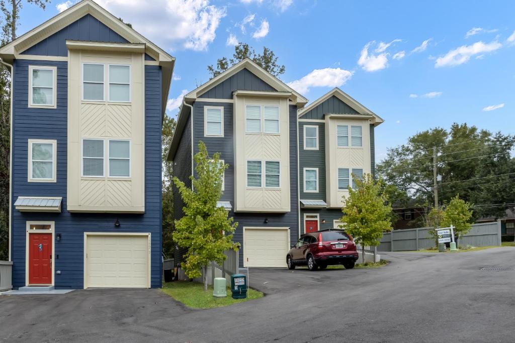 a row of houses in a parking lot at Brand New Stylish Home for Your Family in Tallahassee