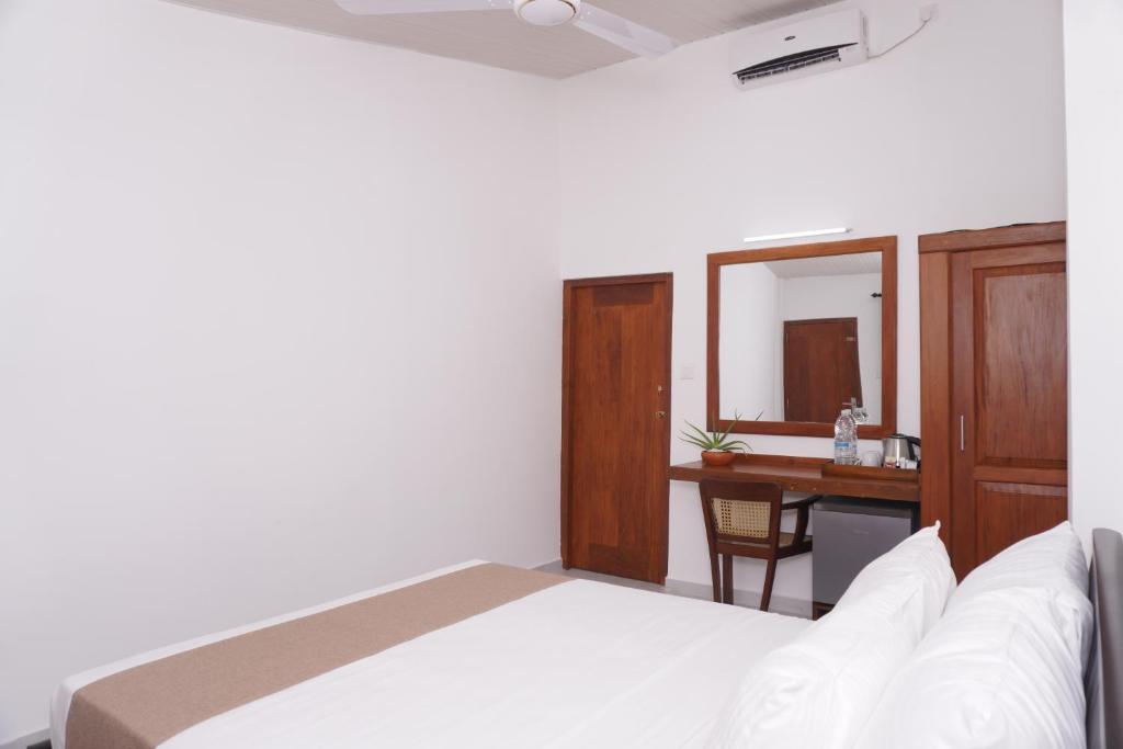 Postel nebo postele na pokoji v ubytování SURF UNA BEACH HOTEL