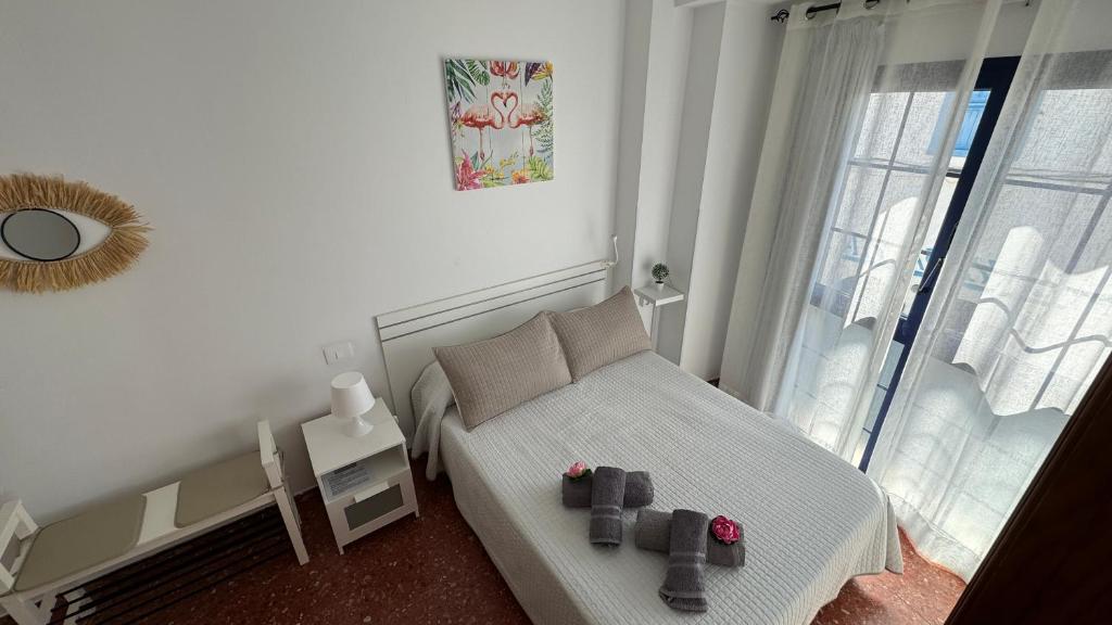 Posteľ alebo postele v izbe v ubytovaní Vivienda Vacacional Tienda Loly