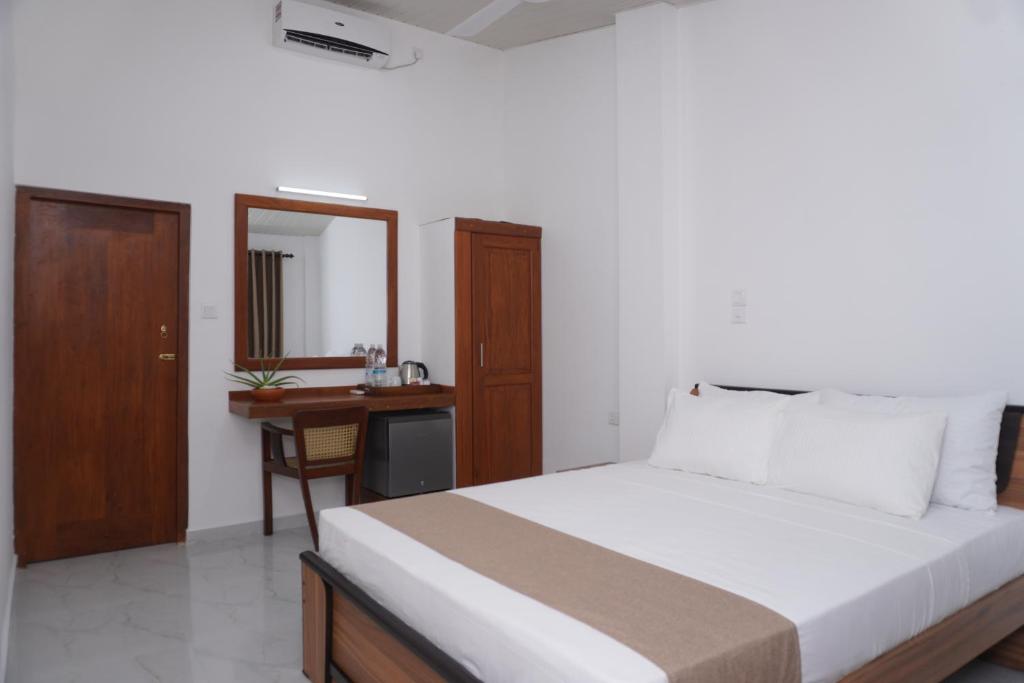 Postel nebo postele na pokoji v ubytování SURF UNA BEACH HOTEL