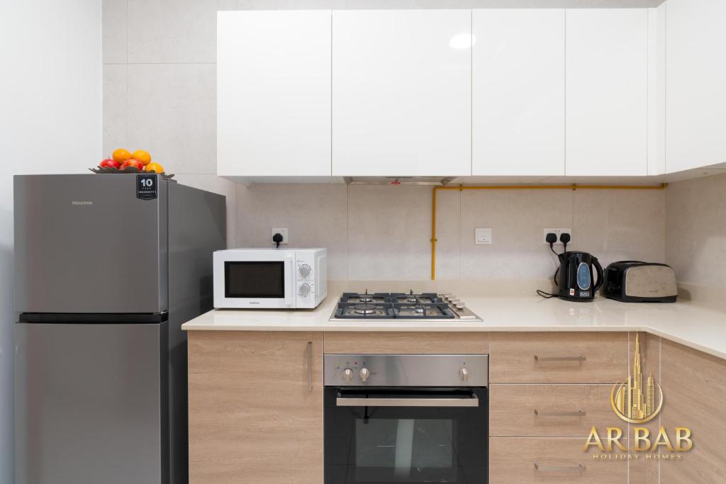 Kuchyň nebo kuchyňský kout v ubytování Arbab Homes Premium 1BR-Canal View-Near Dubai Mall