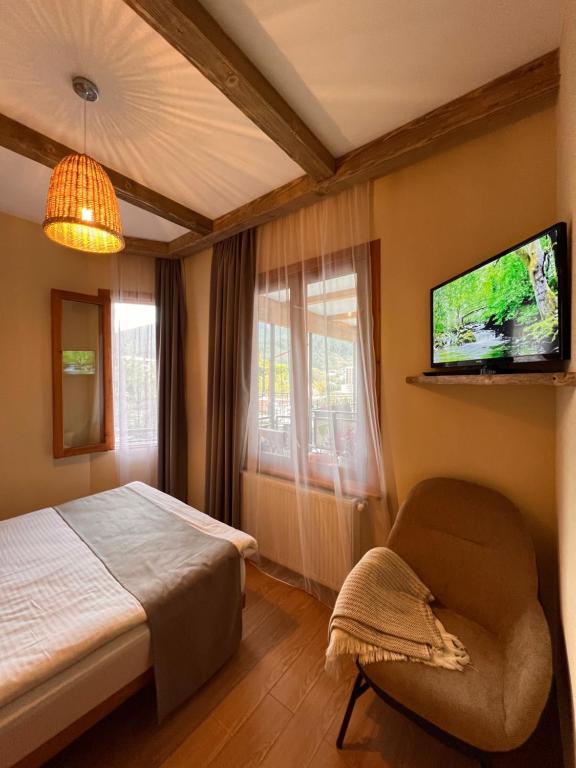 Postel nebo postele na pokoji v ubytování Hotel Borjomi Verde