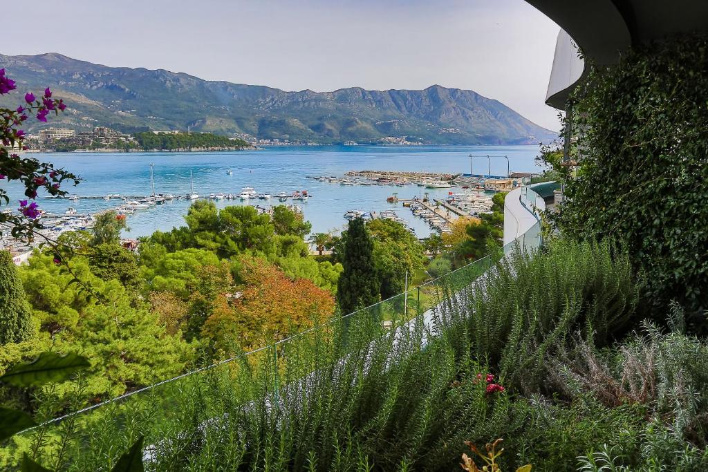 a view of a body of water from a hill at Royal Gardens Paradise in Budva