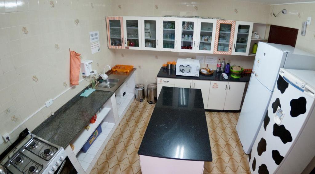 Kuchyň nebo kuchyňský kout v ubytování Jardim Botânico House