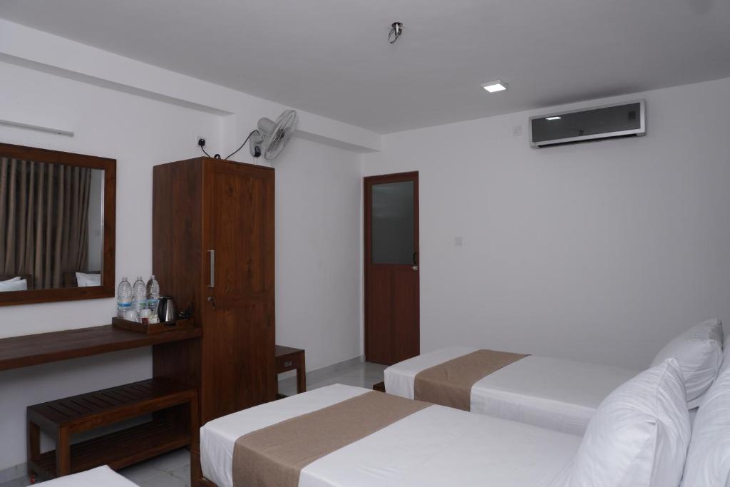Postel nebo postele na pokoji v ubytování SURF UNA BEACH HOTEL