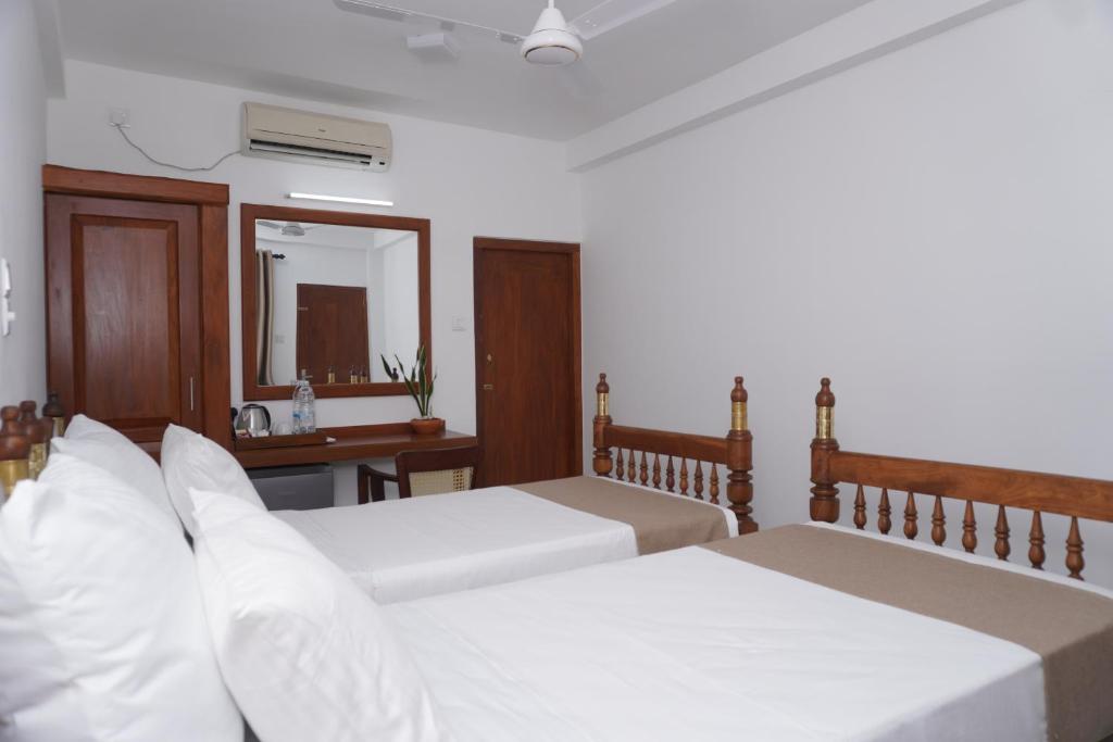 Postel nebo postele na pokoji v ubytování SURF UNA BEACH HOTEL