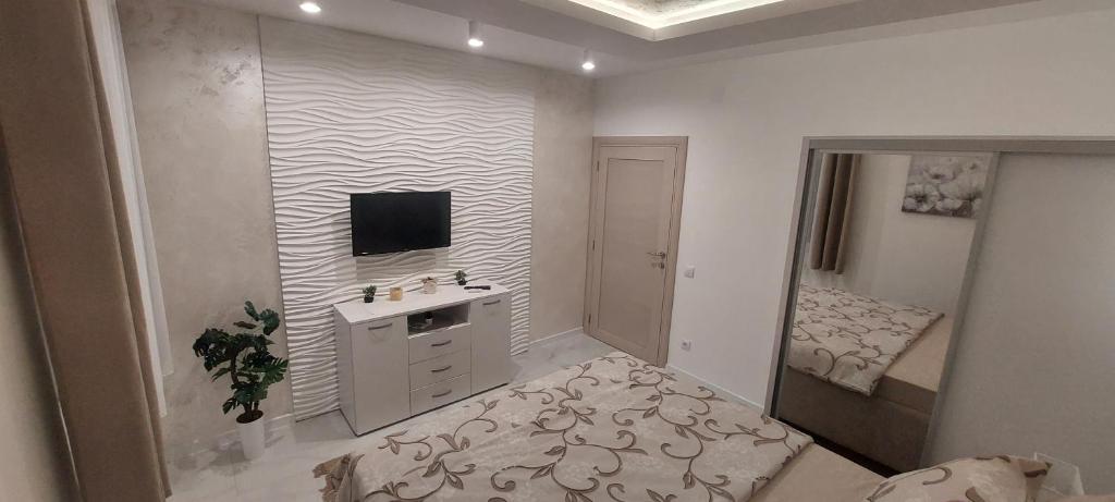 Postel nebo postele na pokoji v ubytování GOLD APARTMANI