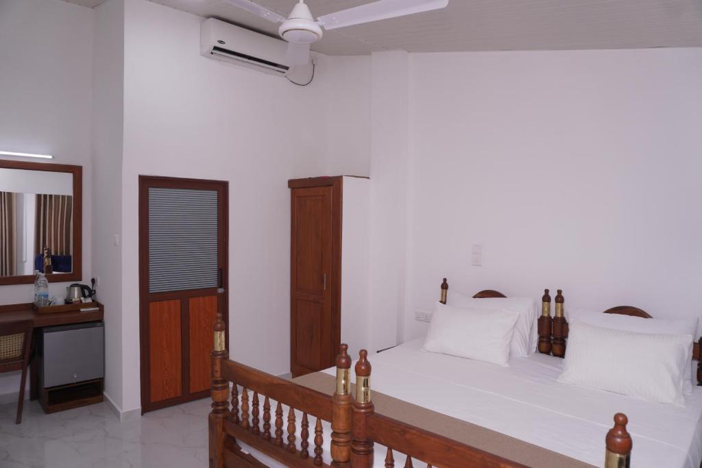 Postel nebo postele na pokoji v ubytování SURF UNA BEACH HOTEL