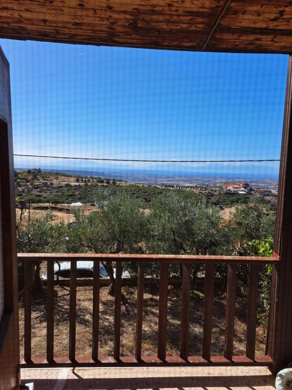 a view of the ocean from the balcony of a house at Μονοκατοικία Μονοπήγαδο in Monopígadhon