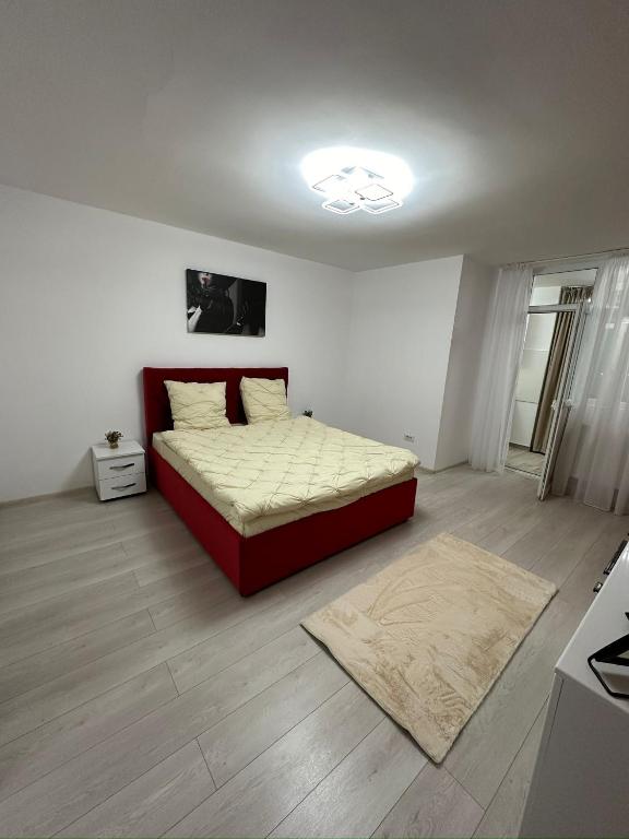 a bedroom with a bed in the middle of the room at Crang Luxury View in Buzău