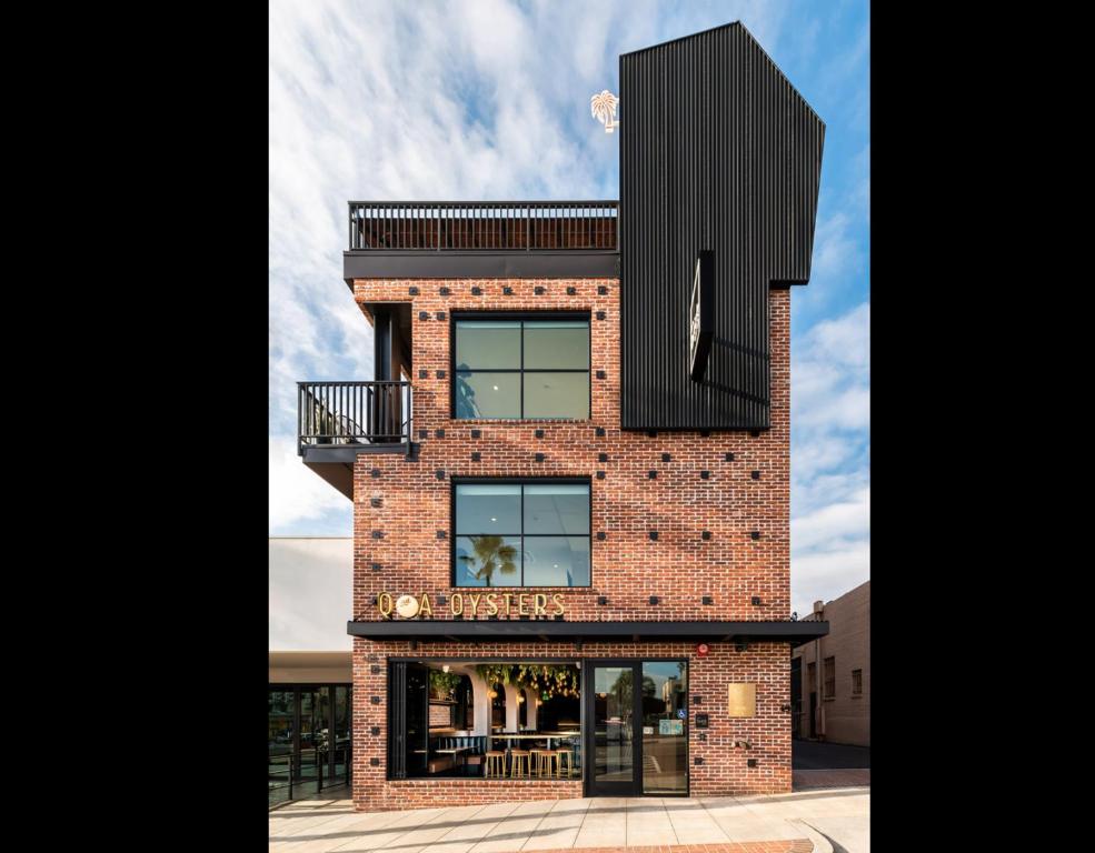 a brick building with a black box on top at The Brick Boutique Hotel in Oceanside