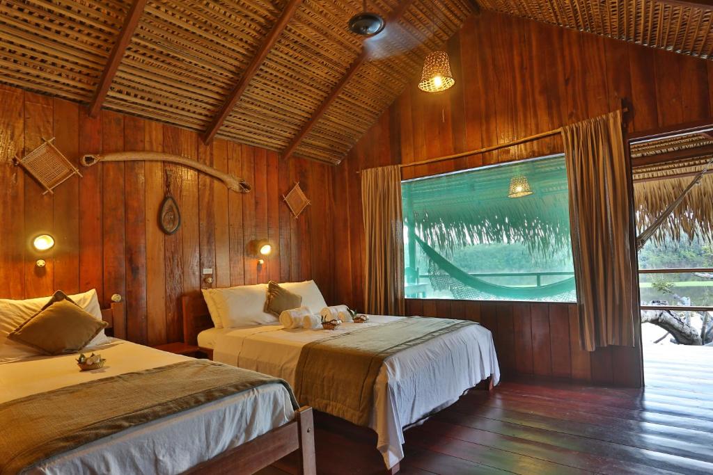 Cama ou camas em um quarto em Juma Amazon Lodge