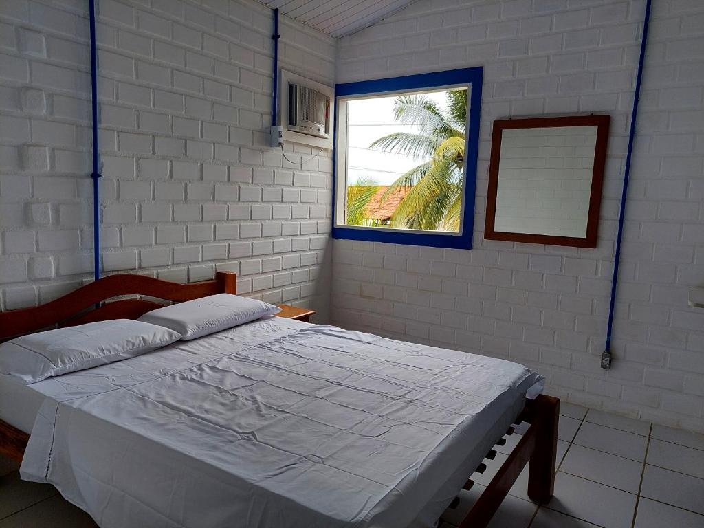Ліжко або ліжка в номері Chalé das Conchas