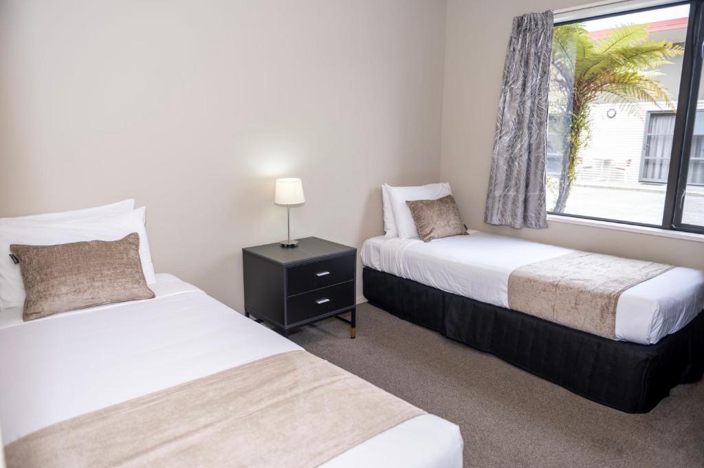 Postel nebo postele na pokoji v ubytování 58 On Cron Motel