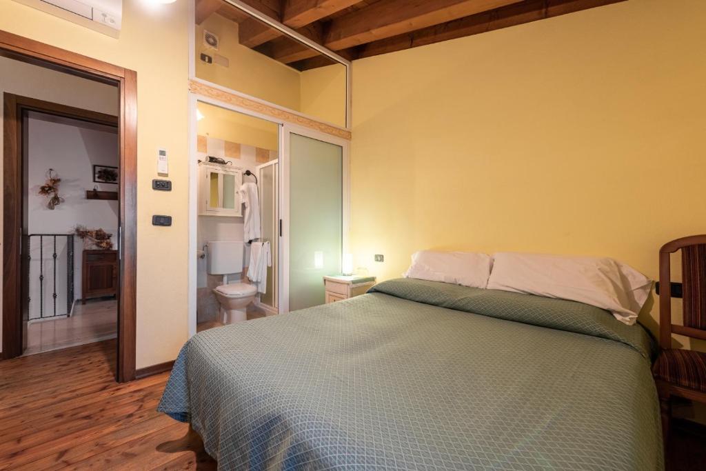 Postel nebo postele na pokoji v ubytování Agriturismo La Prateria