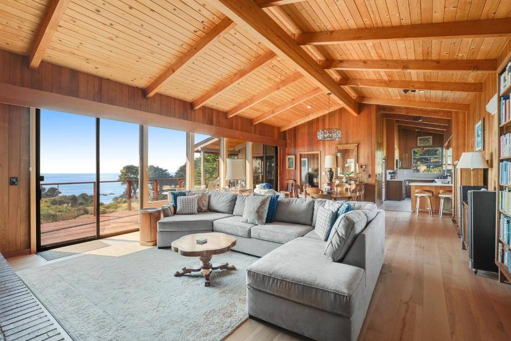 a living room with a couch and a table at Rosemary's Retreat in Mendocino