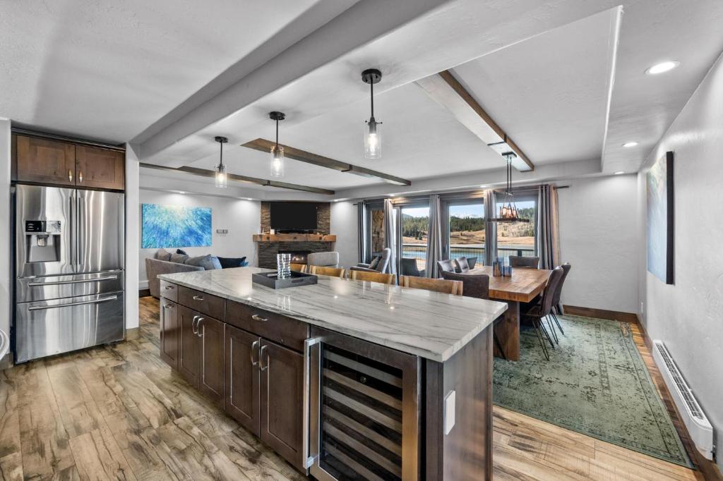 a kitchen and living room with a table and a dining room at Corinthian Circle - Dillon in Dillon