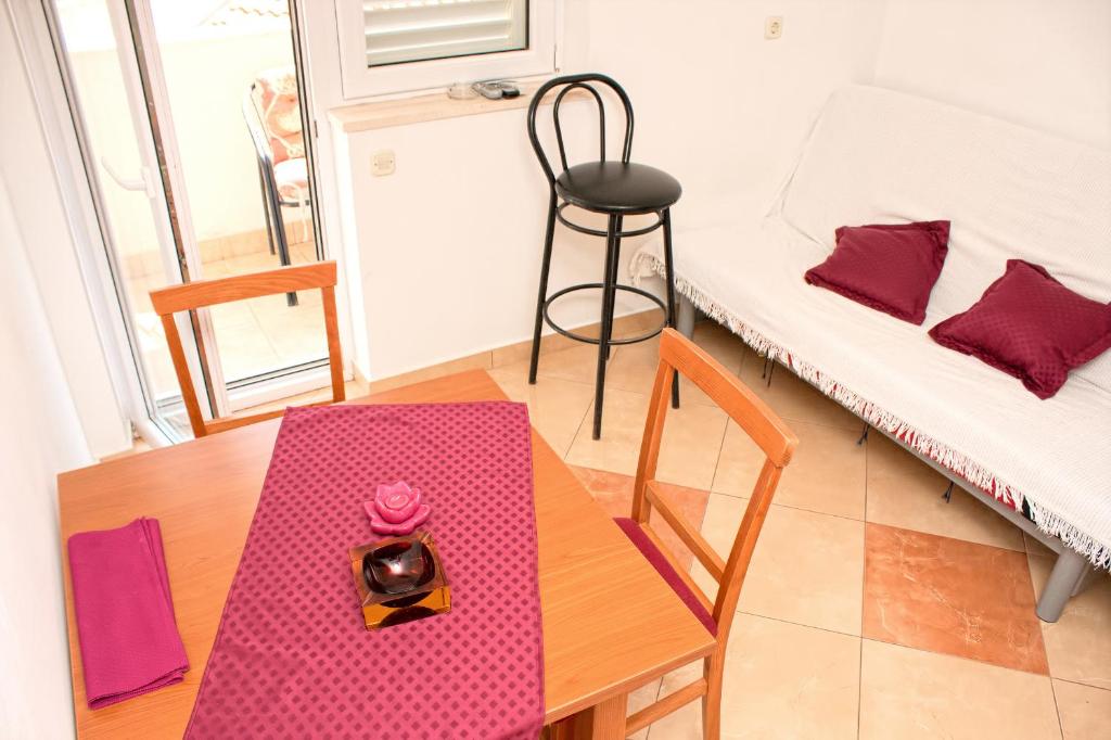 Postel nebo postele na pokoji v ubytování Apartments Dani