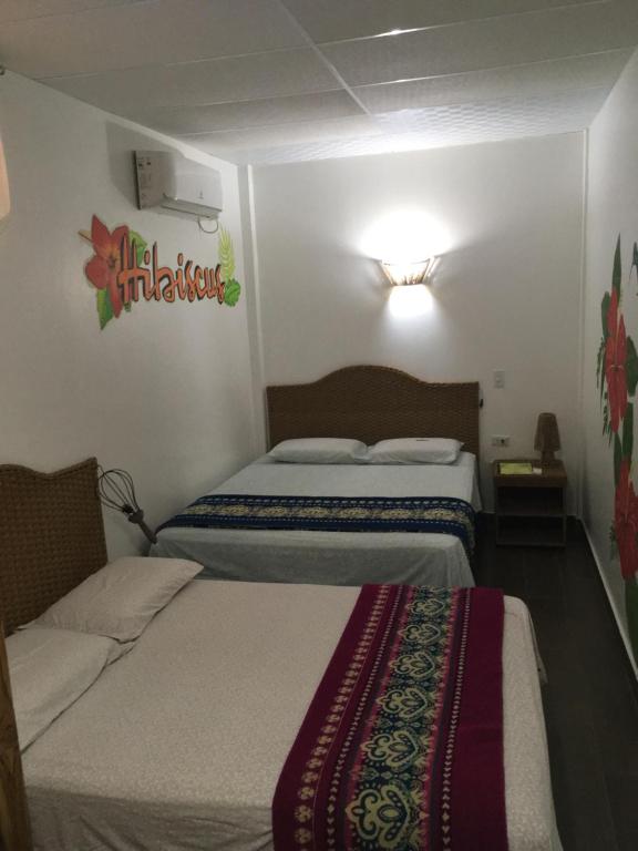 Postel nebo postele na pokoji v ubytování CASITA MADAME