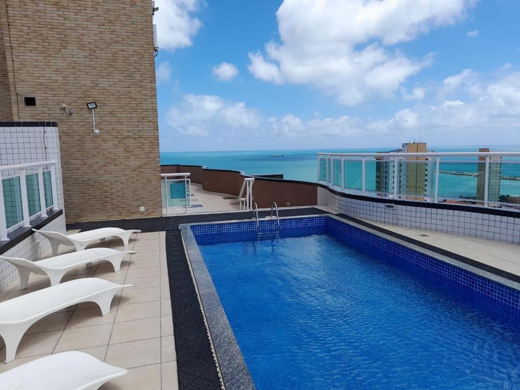 a swimming pool on the roof of a building at Studio Iracema 2001 in Fortaleza