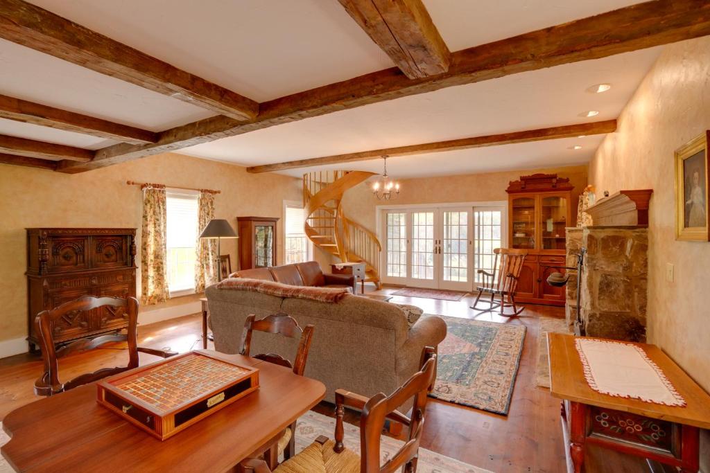 a living room with a couch and a table at Historic New Lebanon Hideaway on 33 Private Acres! in New Lebanon