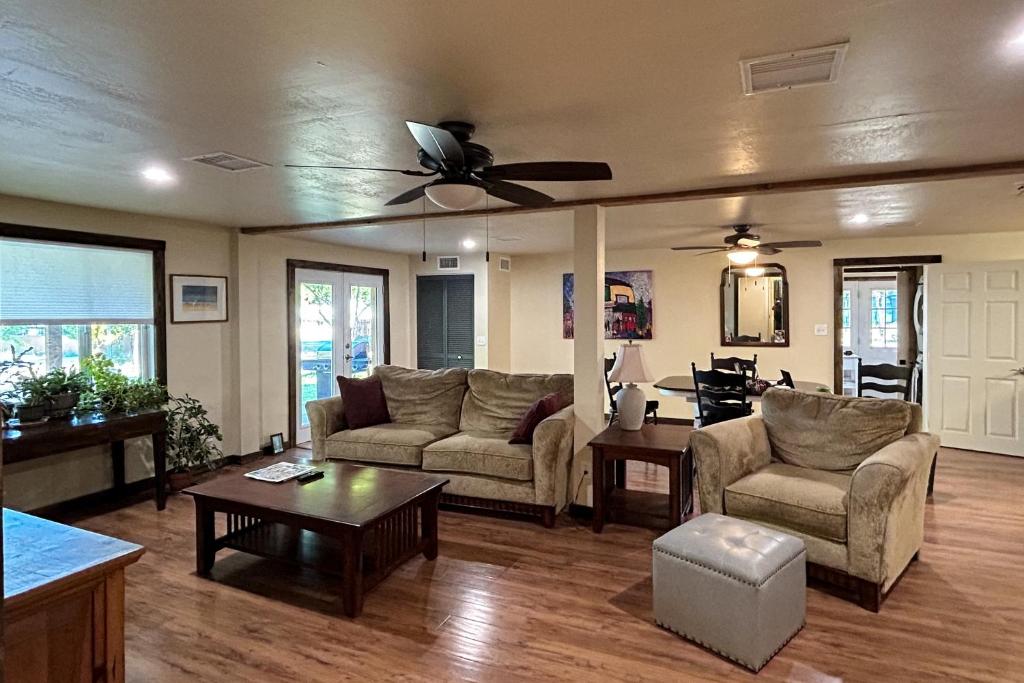 a living room with couches and a ceiling fan at Rocking S Ranch in Cottonwood